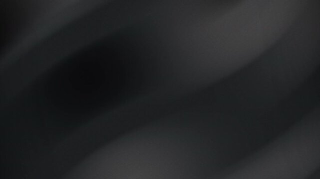 Abstract background with blurred black and grey shapes in diagonal pattern. Suitable for cover designs, web backgrounds, and digital art.