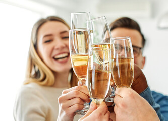 A portrait of young businesspeople or friends celebrating business success with a tost  in the office or young people having a party, teamwork and togetherness and having fun and friendship concept