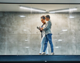 Portrait of two young business woman having a meeting or presentation and seminar standing in the office. Portrait of a young business woman talking