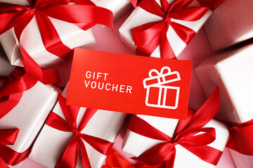 gift certificate coupon voucher lies on gifts