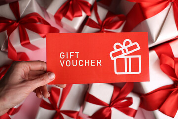 gift certificate coupon voucher lies on gifts