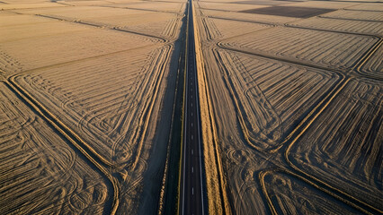 Symmetrical Trench Roads in Golden Fields &ndash; Aerial View of Tilled farmland
