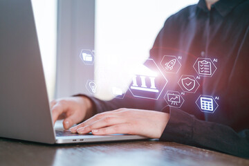 Working on a laptop with digital bank icons and artificial intelligence symbols in a modern office setting during the day