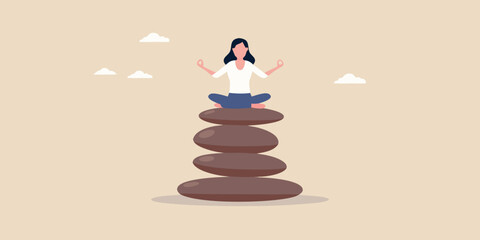Woman meditating in lotus position atop a balanced stone tower