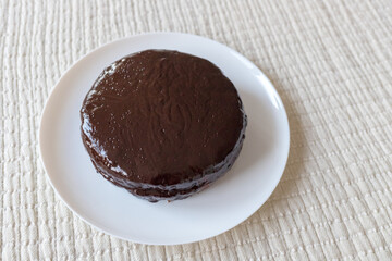 Chocolate cake Prague on the white background. Traditional Sacher cake. Ready to eat.