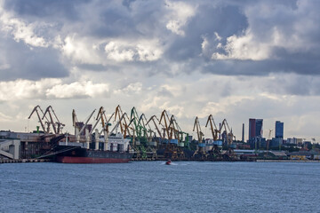 Beautiful clouds over the seaport on a summer day. The port of Klaipeda, Lithuania, is located in the northern part of the Curonian Lagoon of the Baltic Sea.