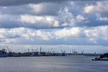 Beautiful clouds over the seaport on a summer day. The port of Klaipeda, Lithuania, is located in the northern part of the Curonian Lagoon of the Baltic Sea.