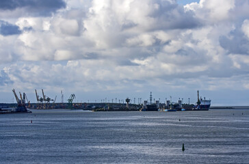 Beautiful clouds over the seaport on a summer day. The port of Klaipeda, Lithuania, is located in the northern part of the Curonian Lagoon of the Baltic Sea.