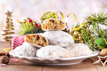 Homemade Christmas stollen bites, miniature, bite-sized versions of traditional Christmas fruit cake bread, chocolate and vanilla stollen cookies biscuits with dried fruits, nuts, marzipan, spices