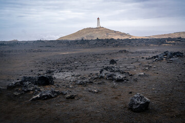 Reykjanes Lighthouse seen from the coast in Iceland's Reykjanes Peninsula on a cloudy day