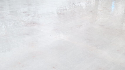Empty winter ice rink with festive Christmas lights creating peaceful holiday mood.