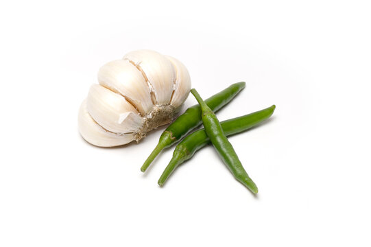 Fresh Garlic Bulb and Green Chili Peppers on White Background