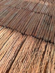 Rustic Red Terracotta Tile Stacks Forming a Repeating Diagonal Pattern