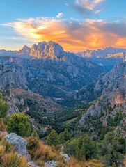 Fototapeta premium Majestic mountain range bathed in golden sunset light over a valley