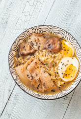 Bowl of ramen with pork belly, soft egg, and shiitake mushrooms
