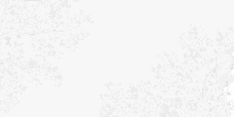 A blurry nearly white image featuring indistinct tree branches and foliage