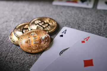 Cryptocurrency bitcoin and playing cards representing online gambling and digital finance