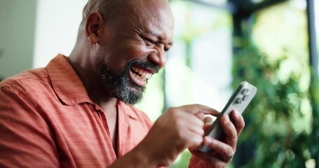 Winner, fist pump or black man in lounge with phone, giveaway or award announcement in online gambling. Success, wow or mature person in home with tech, prize update or victory in digital lottery.