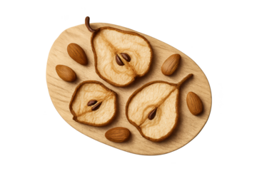 Dried pear slices arranged on wooden board with almonds