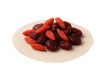 Pile of goji berries and dark dried berries on beige mat