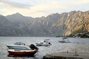 Docked yachts near mountains and coastline