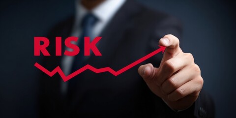 Businessman pointing at increasing risk graph with red line