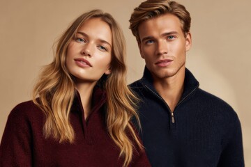 Young couple wearing stylish quarter-zip sweaters. Concept of autumn fashion trends and premium knitwear collection.