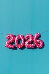 pink balloons displaying the number 2026 outdoors