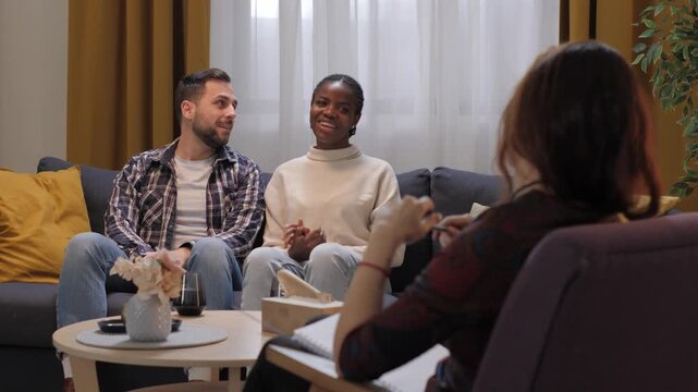 Interracial couple resolving conflicts in therapy session