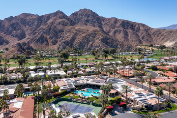Large Home and Neighborhood with Mountains Aerial