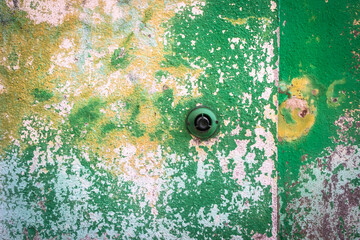 Dettaglio di un muro dall'intonaco colorato e scrostato di una casa di Burano