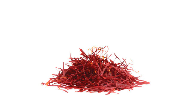 Heap of premium red saffron threads isolated on a clean light gray background.