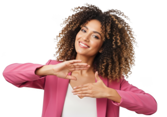 Smiling young woman with voluminous curly hair making a heart shape with her hands isolated on transparent background