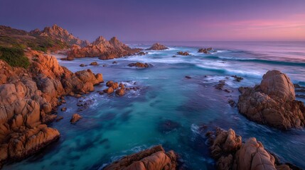 Fototapeta premium Rocky coast with turquoise water at sunset