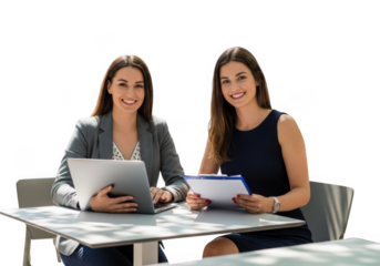 Two smiling women working together with laptops and documents isolated on transparent background