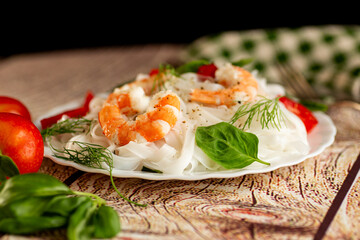 Healthy low-calorie dish rice noodles shrimp tomatoes and dill