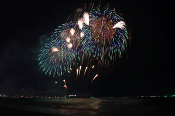 Colorful firework with bokeh light up the sky. New Year celebration, Abstract holiday background