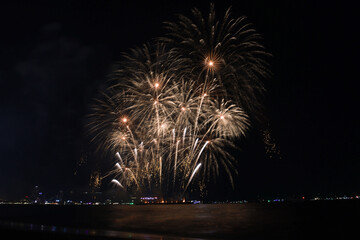 Colorful firework with bokeh light up the sky. New Year celebration, Abstract holiday background
