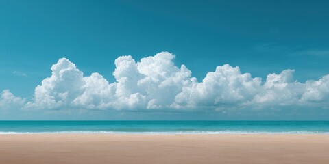 Tranquil beach with clear blue sky and fluffy clouds