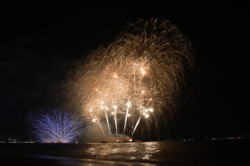 Colorful firework with bokeh light up the sky. New Year celebration, Abstract holiday background