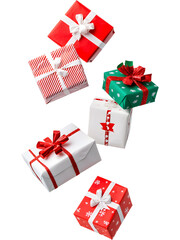 .Colorful Christmas gift boxes in green, red, and white tones floating on transparent background. Playful festive arrangement perfect for holiday graphics