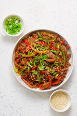 Funchoza with chicken and vegetables and teriyaki sauce