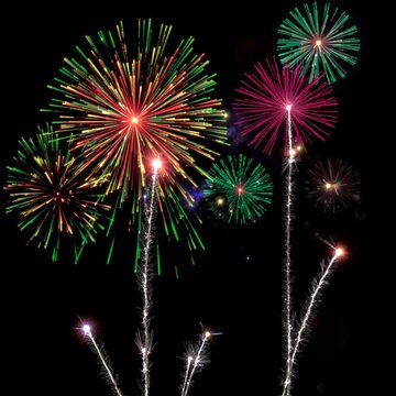 Vibrant colorful fireworks exploding in the night sky during a celebration or festival event