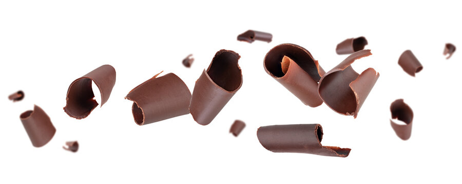 Chocolate curls fly and levitate in space. Isolated on white.