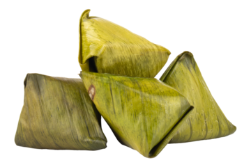 Dessert wrapped in banana leaves isolated on white background
