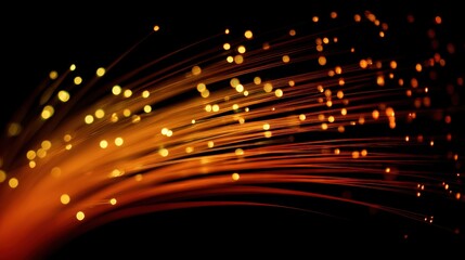 Dynamic glowing orange and yellow fiber optic strands illustrating data flow and connectivity