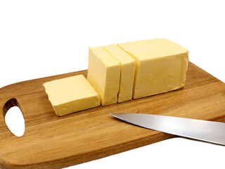Pieces of butter on a wooden cutting board. Vegetable margarine.