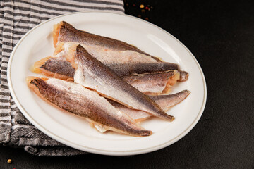 Hake fillet raw fish seafood healthy food main course ingredient appetizer fresh gourmet food table setting rustic food top view copy space pescatarian diet