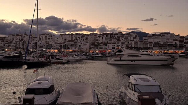Puerto Banus. Boats in Harbor During Sunset at Coastal Town