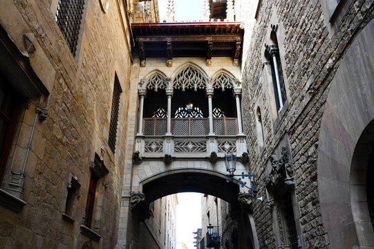 low angle perspective view of the pont del bisbe or bishop's bridge in Barcelona, Spain in the Gothic Quarter.  old architecture. landmark building. tourist destination and attraction. 
